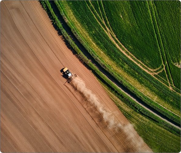 aerial shot of farm machinery in field